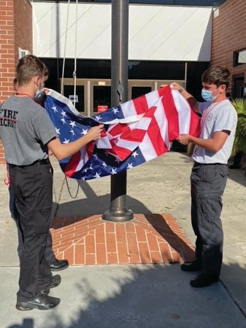 LHS Fire Academy students learn how to fold the flag properly.